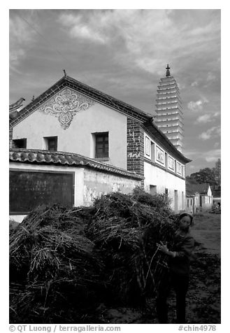 Rural activity in a street close to the Three Pagodas. Dali, Yunnan, China (black and white)