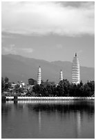 San Ta Si (Three pagodas) reflected in a lake, early morning. Dali, Yunnan, China ( black and white)