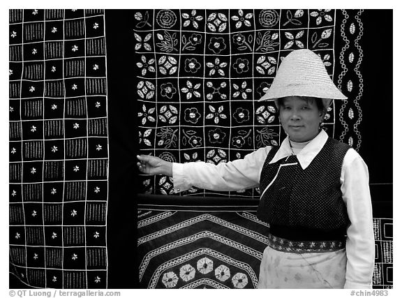 Woman in Bai dress showing drapes of traditional design. Dali, Yunnan, China