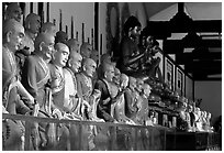 Some of the 1000 individually unique Terracotta arhat monks in Luohan Hall. Leshan, Sichuan, China ( black and white)
