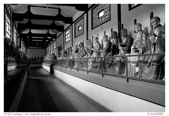 Some of the 1000 Terracotta arhat monks in Luohan Hall. Leshan, Sichuan, China (black and white)