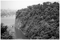 Cliffs of Lingyun Hill with the city in the background. Leshan, Sichuan, China ( black and white)