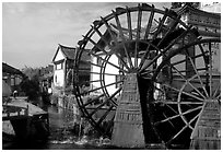 Big water wheel at the entrance of the Old Town. Lijiang, Yunnan, China (black and white)