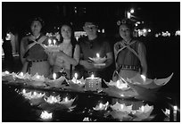 Candlelight lanters to be floated on a canal at night. Lijiang, Yunnan, China ( black and white)