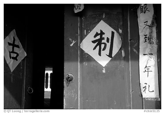Doorway with Chinese script. Lijiang, Yunnan, China (black and white)