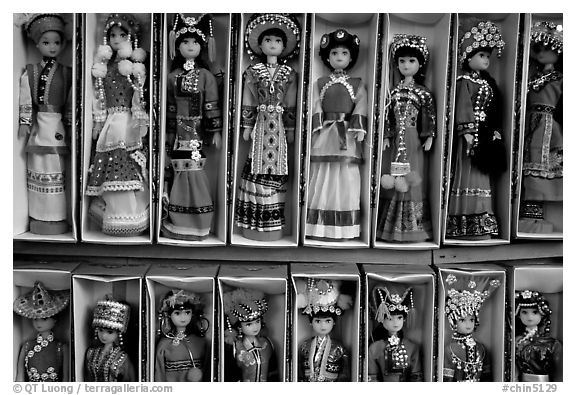 Dolls wearing traditional Bai dress. Lijiang, Yunnan, China (black and white)