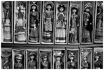 Dolls wearing traditional Bai dress. Lijiang, Yunnan, China (black and white)