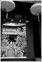 Ming dynasty Wufeng Lou (Five Phoenix Hall), seen through entrance arch. Lijiang, Yunnan, China ( black and white)