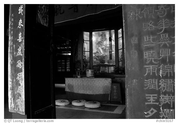 Buddha image and altar in Hongchunping temple. Emei Shan, Sichuan, China (black and white)