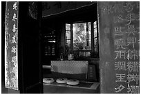 Buddha image and altar in Hongchunping temple. Emei Shan, Sichuan, China ( black and white)