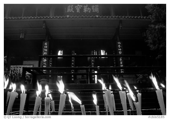 Candles burning in front of Wannian Si temple. Emei Shan, Sichuan, China (black and white)