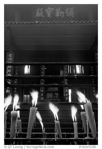 Candles burning in front of Wannian Si temple. Emei Shan, Sichuan, China