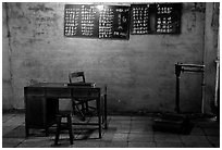 Desk with counting frame, blackboard with Chinese script, scale. Emei Shan, Sichuan, China ( black and white)