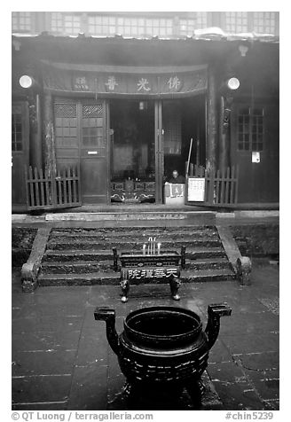 Urn in courtyard inside Xixiangchi temple. Emei Shan, Sichuan, China (black and white)