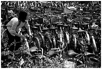Retriving a bike in the bicycle parking lot. Chengdu, Sichuan, China ( black and white)