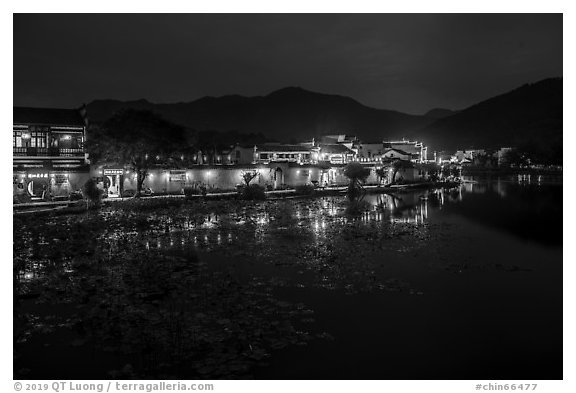 Hongcun village reflected in South Lake at night. Hongcun Village, Anhui, China (black and white)