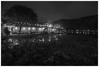 Houses reflected in South Lake at night. Hongcun Village, Anhui, China ( black and white)