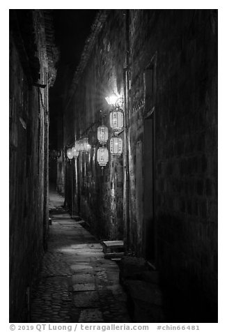 Alley with lanterns at night. Hongcun Village, Anhui, China (black and white)