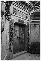 Door with red caligraphed banners. Hongcun Village, Anhui, China ( black and white)