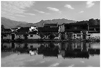 Village reflected in Nanhu Lake, morning. Hongcun Village, Anhui, China ( black and white)