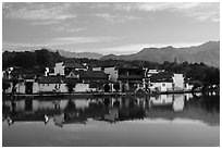 Village reflected in South Lake. Hongcun Village, Anhui, China ( black and white)