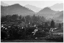 Village and hills in morning fog. Xidi Village, Anhui, China ( black and white)