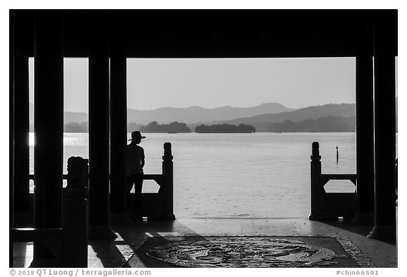 Man in Cuiguang Pavilion and West Lake. Hangzhou, China (black and white)