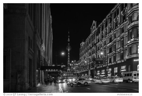 Colonial buildings and Oriental Pearl Tower at night. Shanghai, China (black and white)