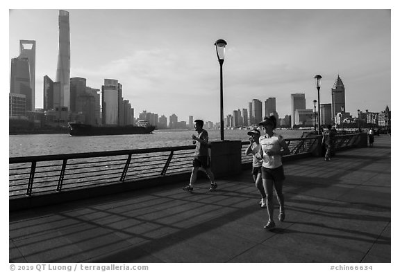 Runners on the Bund. Shanghai, China (black and white)