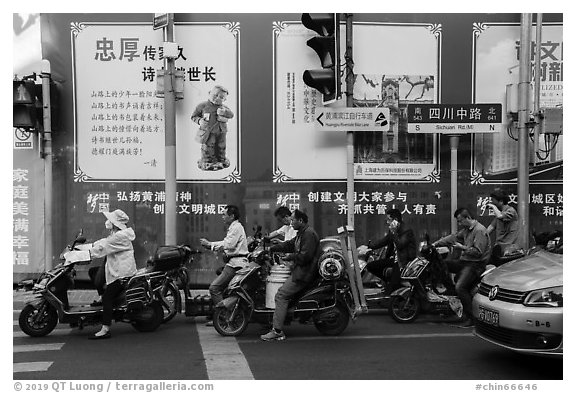 Motercycle riders waiting at trafic light. Shanghai, China (black and white)