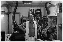 Ivory merchant with mammoth tusk. Shanghai, China ( black and white)