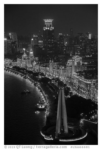 Peoples Memorial and illuminated Bund buildings at night from above. Shanghai, China (black and white)