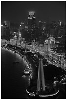 Peoples Memorial and illuminated Bund buildings at night from above. Shanghai, China ( black and white)