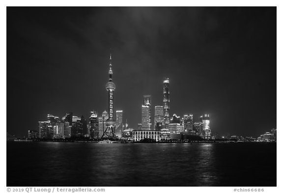 Shanghai skyline with Oriental Perl Tower and Huangpu River at night. Shanghai, China (black and white)