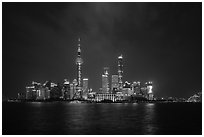 Shanghai skyline with Oriental Perl Tower and Huangpu River at night. Shanghai, China ( black and white)