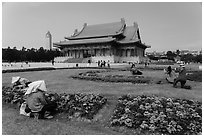 Grounds of Chiang Kai-shek memorial with workers and tourists. Taipei, Taiwan (black and white)