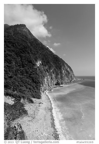Lush high hills drop into turquoise ocean. Taroko National Park, Taiwan (black and white)