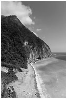 Lush high hills drop into turquoise ocean. Taroko National Park, Taiwan ( black and white)