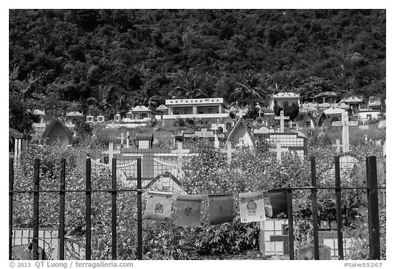 Prayer flags and graves on hillside, Chongde. Taiwan (black and white)