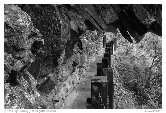 Narrow trail under rock overhang, Taroko Gorge. Taroko National Park, Taiwan (black and white)