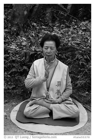 Woman meditating. Sun Moon Lake, Taiwan