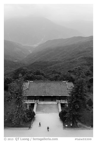 Two people, temple, and misty mountains, Tsen Pagoda. Sun Moon Lake, Taiwan (black and white)