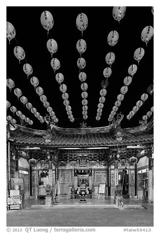 Array of red paper lanterns and temple at night. Lukang, Taiwan (black and white)