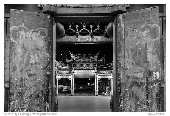 Painted doors, looking towards gate at night, Tienhou Temple. Lukang, Taiwan (black and white)