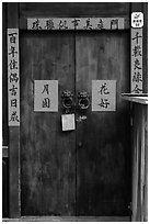 Wooden door traditional lock and chinese inscription on red paper. Lukang, Taiwan ( black and white)