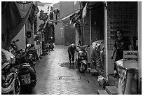 Woman cleaning in alley. Lukang, Taiwan ( black and white)