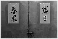 Blue door detail wiht Chinese script on red. Lukang, Taiwan (black and white)