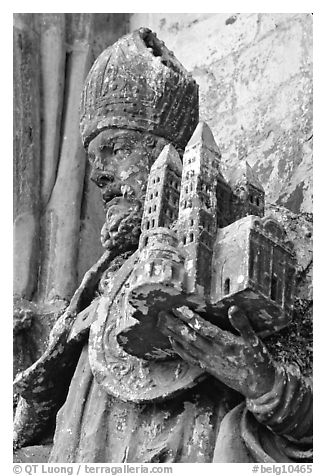 Statue outside of Notre Dame Cathedral showing a model of the cathedral being held. Tournai, Belgium