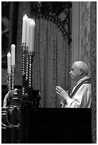 Priest in the the Basilica of Holy Blood. Bruges, Belgium (black and white)