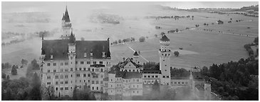 Neuschwanstein castle and fog. Bavaria, Germany (Panoramic black and white)